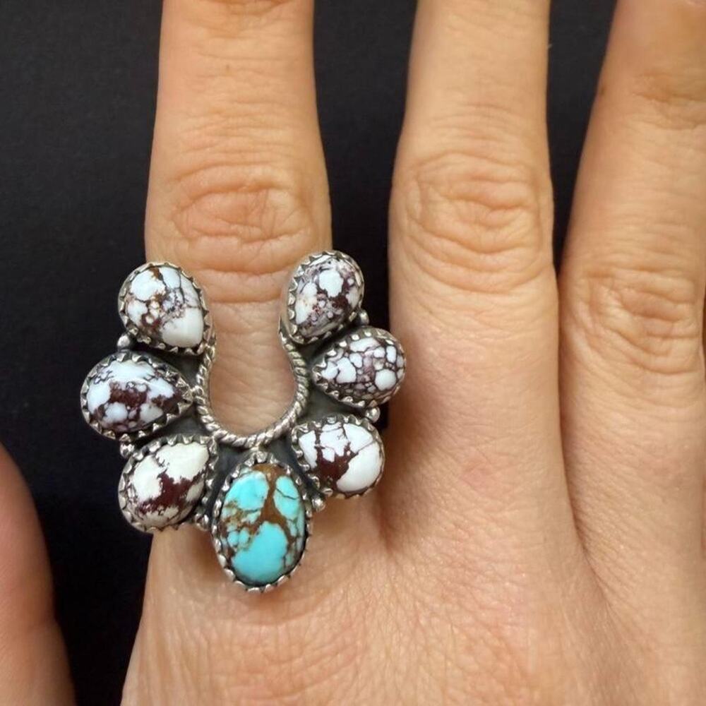 Sterling silver wild horse and kingman turquoise naja ring. Adjustable